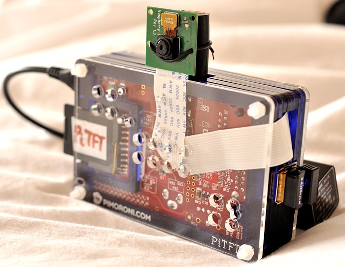 Pimoroni PiTFT Pibow with camera ribbon cable tucked inside the case